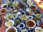 Ahearty meal consisting of vegetable-based dishes and dips prepared with olive oil