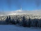 Praděd is the tallest peak in the Jeseniky mountains. It's very popular for tourists to climb up to that telephone tower. There's even a restaurant inside!