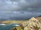 This is the view from a hike in Dingle; there is a lovely contrast between the sun and the looming dark clouds 