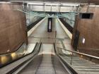 Going down an escalator to reach the underground platform of an U-Bahn Station