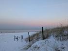 Here is a photo from sunset one night featuring some snowfall on the island’s protected dunes.