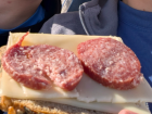 Many students eat some variation of bread, cheese, and salami for breakfast. The version pictured is on a thin slice of dark whole wheat bread, with a thicker salami stick cut onto it.