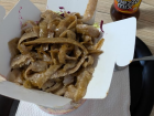 Döner is a turkish streetfood found all over Germany. It features shredded meat, usually chicken or lamb, with french fries. It is pictured here with Mezzo Mix, a sort of cola-fanta mixture.