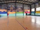 This is the school gym where kids play sports like volleyball and basketball