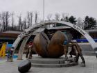 A monument at the DMZ showing people trying to put together North and South Korea again