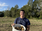 Potato picking was super fun—here is a picture of me with one of my buckets!