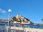 The playground in Roccella with a castle in the distance, on the other side of it is the ocean