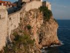 The city walls rest above the dramatic cliffside