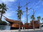 A tour boat in Dubrovnik's port near the produce market