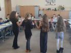 Riana and her classmates performing a dance together