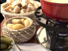 Here, you can see the bread, potatoes, pickles and the pot of fondue!