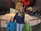 Standing in front of the Earth sculpture at the Natural History Museum with my nephews