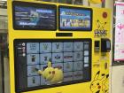 This vending machine in a train station sells Pokemon items, and the little Pikachu on the screen moves around and waves.