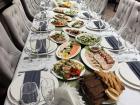 A table laden with delicacies at a Moldovan birthday celebration 