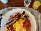 A full English breakfast, commonly found in Malawian cafés. Malawi gained independence from Britain in 1964, and some food traditions still reflect that history.