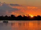 Sunset along the Zambezi, with hippo calls echoing across the water.