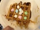 A waffle filled with sugar granules. I had caramel sauce and marshmallows on top of mine