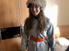 Here is a photo of me in traditional Mongolian clothing worn during Tsagaan Sar! I am wearing a deel (Mongolian traditional dress) made for women.