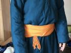 This is an image of what a deel (Mongolian traditional dress) looks like for men. Notice how the belt is a different size and is placed differently.