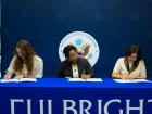 A picture of my coteacher, a Foreign Service Officer, and me signing my Fulbright grant agreement document.