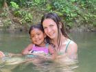Swimming in a river near my house with my little neighbor, Violet