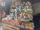 A street vendor selling produce at the local market in the capital district of Lesotho, Maseru