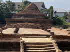 Ancient brick ruins, showing how Thai temples often preserve historical structures while remaining active spiritual spaces