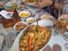 Fried rice and seafood dish. Note the canchita (small corn kernels, often salted) on the table!