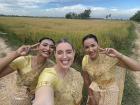 Me and two bridesmaids taking pictures in the local rice field before the wedding ceremony 