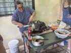 My friend's host dad unveiling the cow's head after five hours on the grill