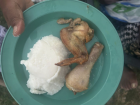 A classic Swazi plate of food, with pap on the side. She had already eaten the cabbage...