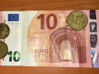 This is a 10 euro bill with a few coins -- the bills feels more like plastic than US dollars