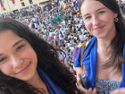 My sister and I watching the Palio in scarves representing the shell neighborhood 