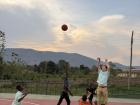 I introduced basketball to my community, and I have enjoyed teaching the young community members how to play an American sport
