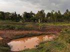 Muddy piles appear throughout the village, as rainy season starts