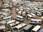Taxis swarm the old taxi park in Kampala