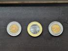 Pula coins from Botswana,2, 5, and 2, almost too pretty to spend