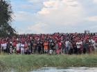 There were thousands of people waiting and watching the boats
