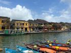 This is a photo of the river and boats of Hoi An during the day