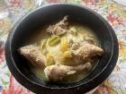 Fufu with quartered chicken and a broth
