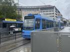 A tram (Straßenbahn) with a bus behind it