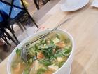 A warm bowl of bún cá in Nha Trang, a fish noodle soup with fresh herbs and broth