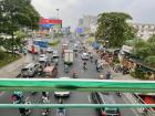 A busy street in Ward 2, Saigon—many people ride motorcycles, like Hân does with her parents to school