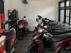 Many motorbikes parked and ready to rent at Minh’s workplace for foreigners in Việt Nam