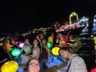 Lantern-lit boats float on the Hoài River in Hội An, a city famous for its colorful lanterns
