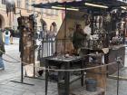 At one of the markets, there was a blacksmith who was making metal into things in front of people! It was super cool to see