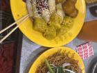 Steamed rice rolls, curry fish balls and siu mai (yellow dumplings)