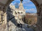 Fisherman's Bastian, a castle that sits on top of a hill, overlooking the city of Budapest and the Danube River.