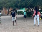 My friends playing soccer with the kids in the village