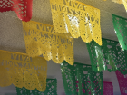These colorful papers are called papel picado, or perforated paper, and are a traditional Mexican craft typically displayed during holidays. This one hangs year-round with the name of the town, Todos Santos.